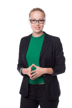 Portrait of beautiful smart young businesswoman in business attire wearin black eyeglasses, standing against white background with arms steeple .