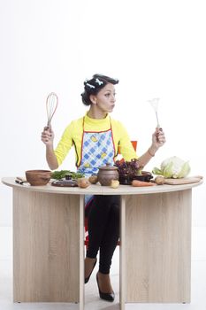 Housewife is preparing in the kitchen on a white background