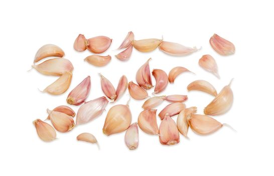 Garlic cloves separated from garlic bulbs on a light background closeup 

