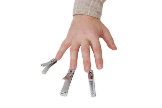 Three nail clippers different sizes in the compound lever style opposite the fingers of a male hand on a light background
