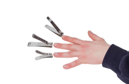Three nail clippers different sizes in the compound lever style opposite the fingers of a male hand on a light background
