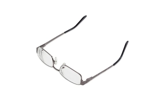 Modern pair of women's eyeglasses with single vision lenses and metal frame on a light background
