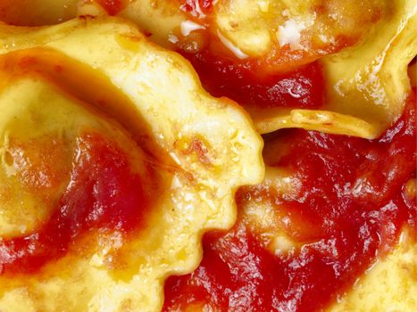 close up of a plate of italian ravioli pasta in tomato sauce