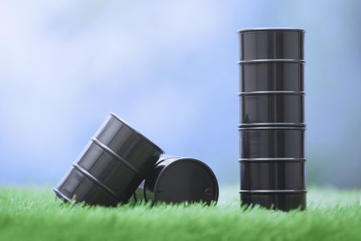 Four oil barrels in the grassland. Horizontal photo
