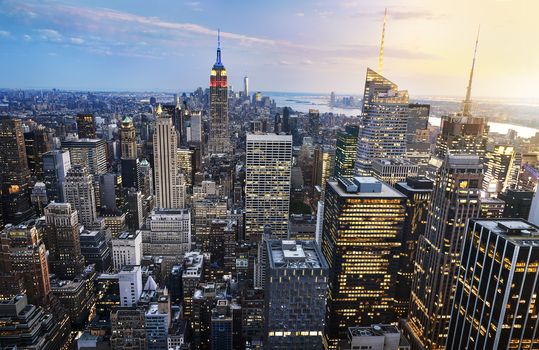 New York City skyline with urban skyscrapers at sunset, USA.