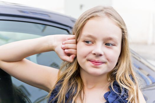 Portrait of cute girl with blond hair