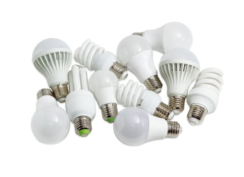 Several different domestic light emitting diode lamps and compact fluorescent lamps with a sized E27 male screw base on a light background 
