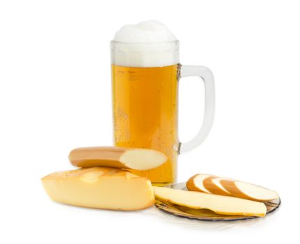 Beer glass with lager beer, piece of a smoked hard cheese, stick of smoked processed cheese and slices of the same smoked cheeses on a saucer on a light background
