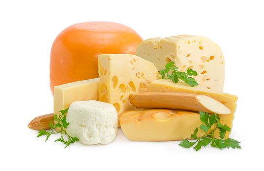 Several different pieces of semi-hard cheese and soft cheese various types and twigs of parsley on a light background
