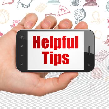 Learning concept: Hand Holding Smartphone with  red text Helpful Tips on display,  Hand Drawn Education Icons background, 3D rendering