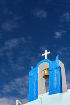 Blue and white orthodox church bell tower. Oia, Santorini Greece. Copyspace