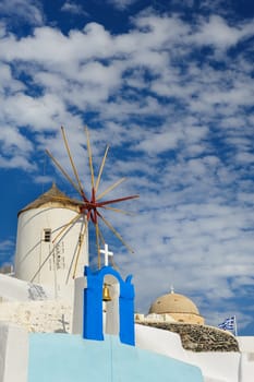 View of Oia windmill at the Island Santorini, Greece. Lot of copyspace.