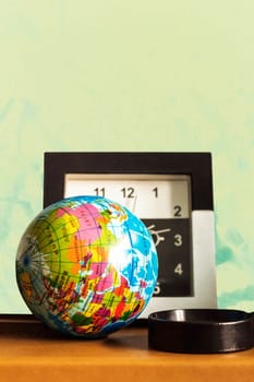 Globe and watches on the table.