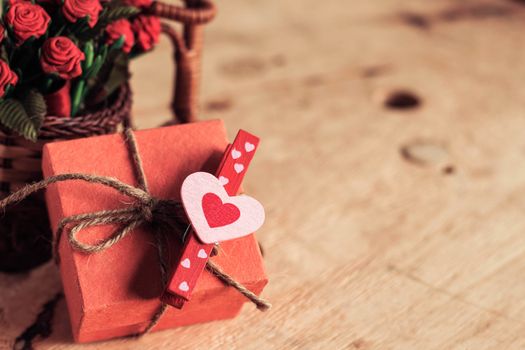 Heart-shaped on gift boxes with wooden floors.