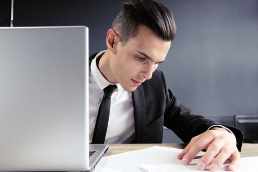 business man working with documents and laptop