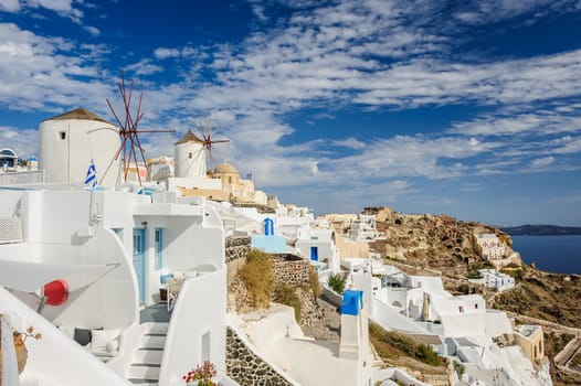 View of famous windmill in Oia village at Santorini Island, Greece. Copyspace.