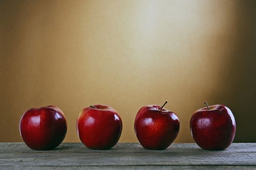 Red apples on a wooden table