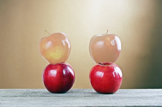 Red apples on a wooden table