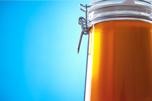 Polish jar of honey flower on a blue background