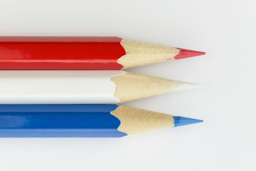 Collection of colorfull pencils in the colors of the Dutch flag as a background picture
