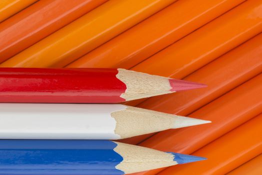 Collection of colorfull pencils in the colors of the Dutch flag as a background picture
