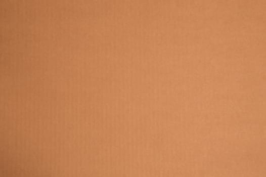 Simple background of plain kraft paper or cardboard with subtle vertical stripes