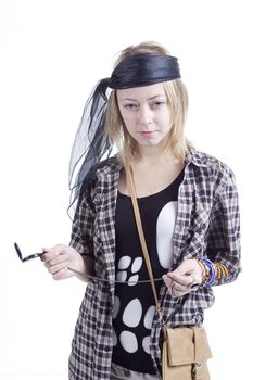 Young woman in the image of a pirate on a white background