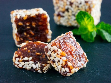 Turkish delight slice on black rustic background. Traditional turkish delight on oriental dark background close up