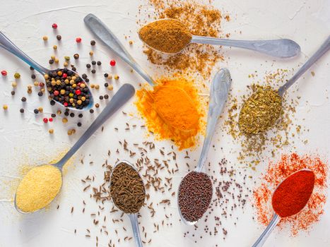 Top view mix indian spices and herbs difference on white background. Food background for design vegetable, healthy lifestyle, spices, herbs or foods content