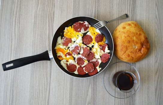 Breakfast pictures of sausage egg in frying pan