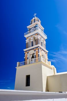 Blue, orange and white orthodox church bell tower. Fira, Santorini Greece.