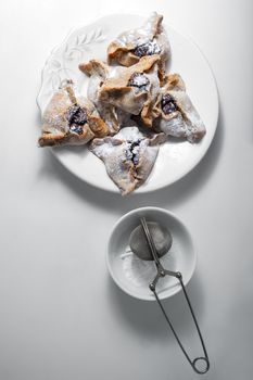 Hamantaschen Cookies for Purim on a white plate