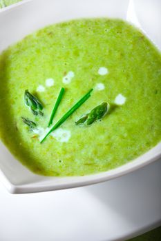 Closeup of a bowl of healthy vegetarian asparagus soup.