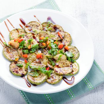 Salad with Fried zucchini on a white background