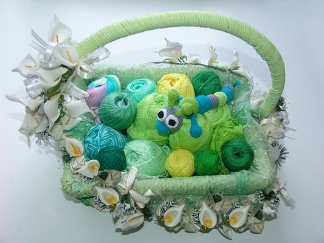 Handicraft goods, greenish yarn.  Toy caterpillar