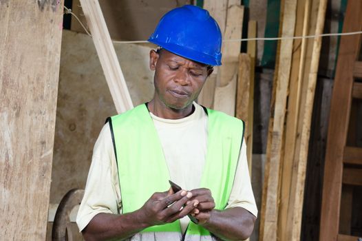 In the morning before starting work , the carpenter replace the blade of his plane.