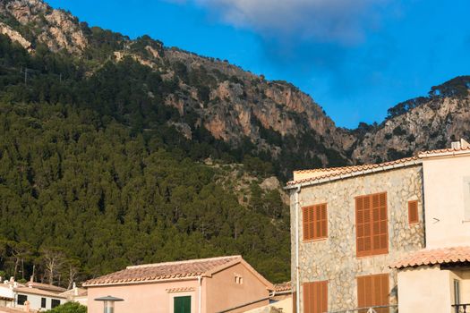 View from the port of Valldemossa to the mountains with the narrow access road.