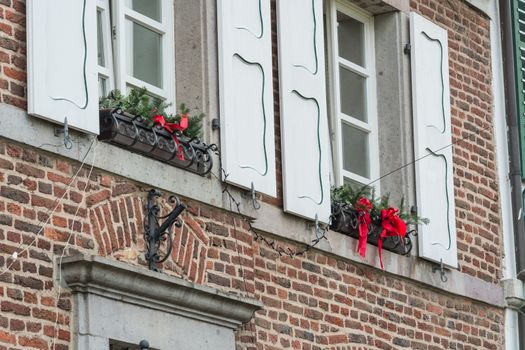 Christmas decoration of an exterior wall of a house with brickwork.