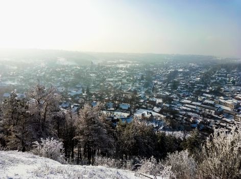 beautiful view of a winter city from atop the mountain