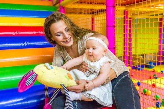 mother and child play in the children's room