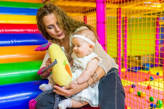 mother and child play in the children's room