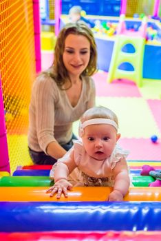 mother and child play in the children's room