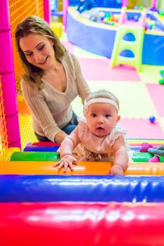 mother and child play in the children's room