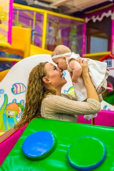 mother and child play in the children's room