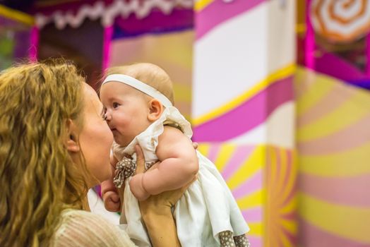 mother and child play in the children's room