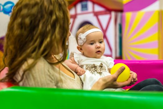 mother and child play in the children's room