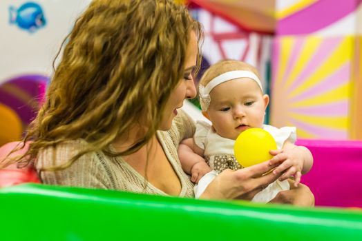 mother and child play in the children's room