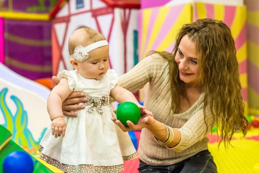 mother and child play in the children's room