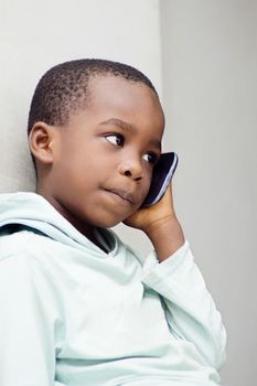 A little boy’s ear phone communicates with  attention.