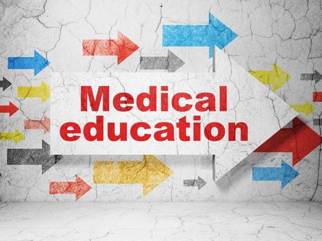 Studying concept:  arrow with Medical Education on grunge textured concrete wall background, 3D rendering